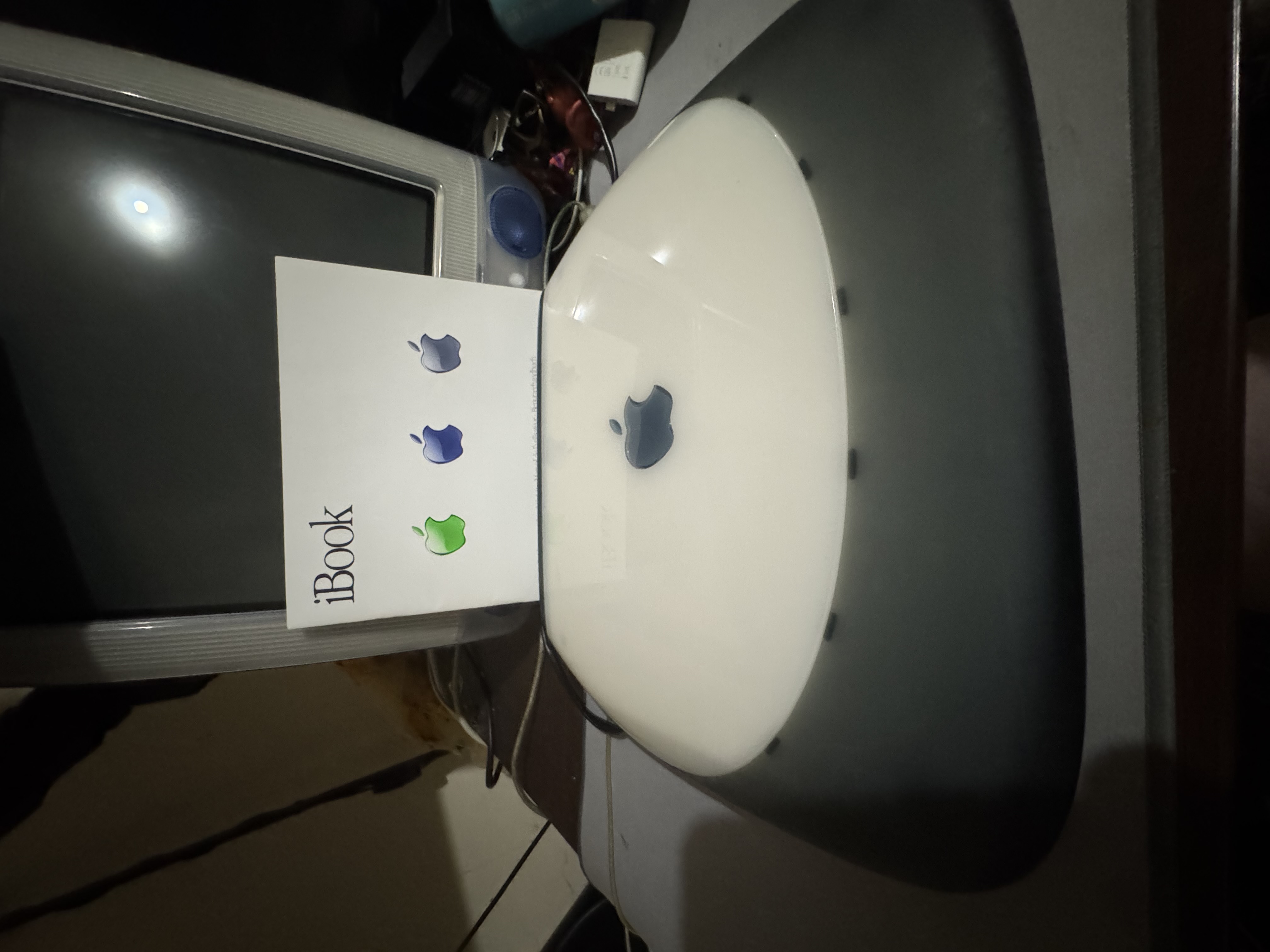 G3 iBook SE — closed, with manual. As it arrived, paperwork and all.
