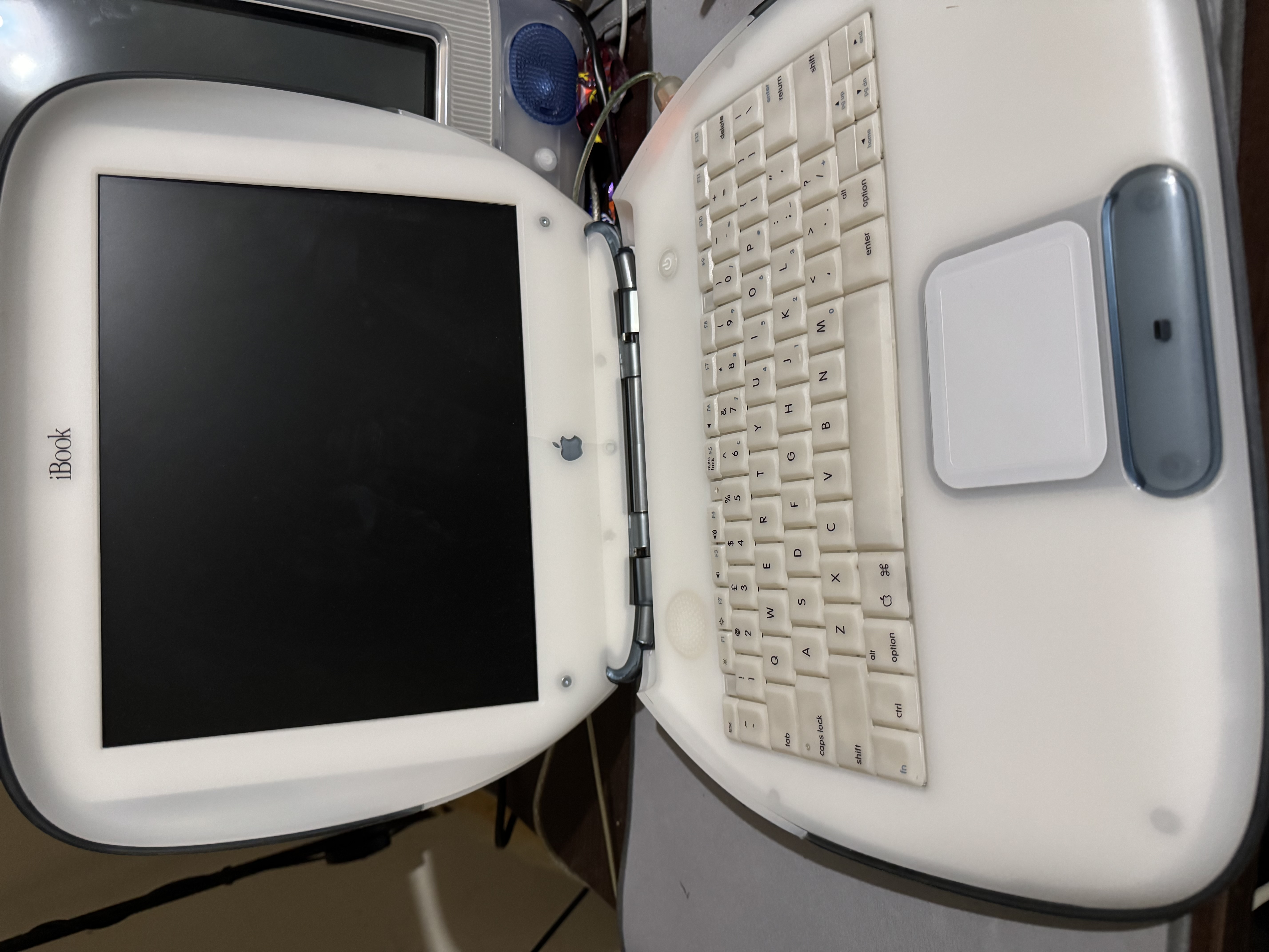 G3 iBook Special Edition with Firewire - The clamshell, lid open.